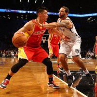 Jeremy Lin #7 of the Houston Rockets dribbles against Deron Williams #8