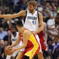 Dirk Nowitzki #41 of the Dallas Mavericks defends Jeremy Lin #7 of the Houston Rockets
