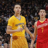 Stephen Curry #30 of the Golden State Warriors stands with Jeremy Lin #7 of the Houston Rockets