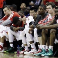 The Houston Rockets bench watches the second half of their NBA basketball game against the Golden State Warriors in Sunday